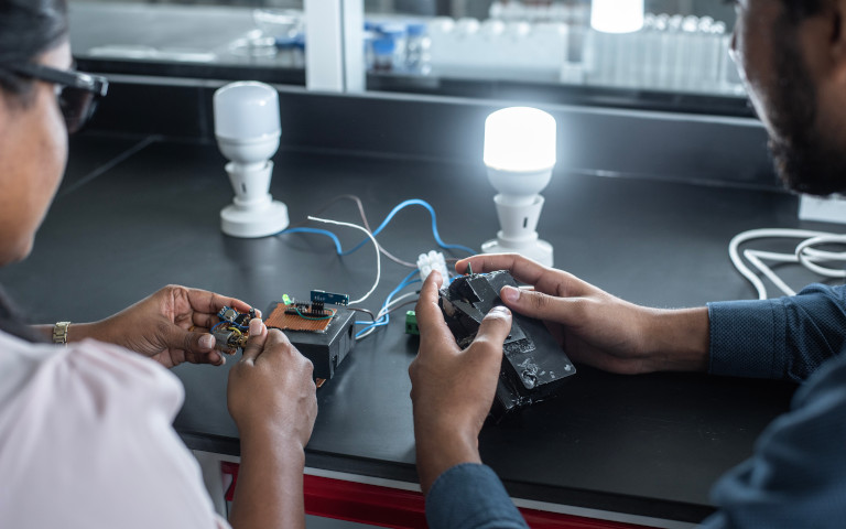 A female and a male researcher working on the energy harvesting switch